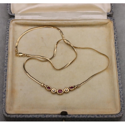 665 - A 9ct gold necklace mounted with 3 small rubies interspersed with 2 small diamonds, 42cm long, 5.7 g... 