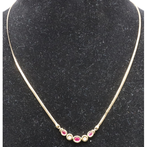 665 - A 9ct gold necklace mounted with 3 small rubies interspersed with 2 small diamonds, 42cm long, 5.7 g... 