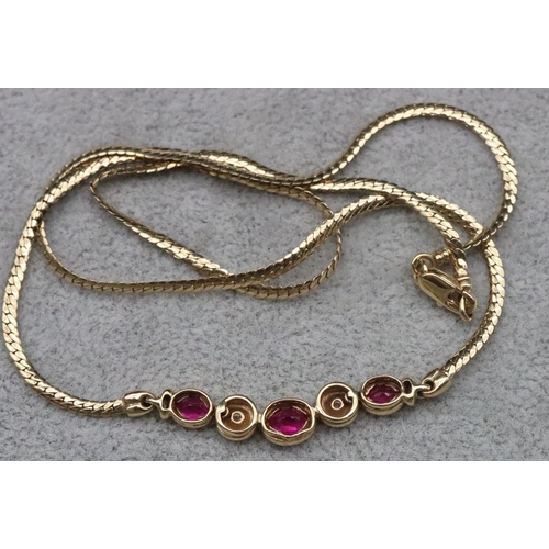 665 - A 9ct gold necklace mounted with 3 small rubies interspersed with 2 small diamonds, 42cm long, 5.7 g... 