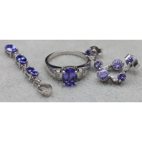 671 - A suite of 18ct white gold tanzanite and diamond jewellery, comprising of ring (Size L), drop pendan... 