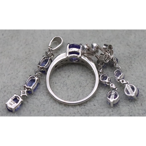 671 - A suite of 18ct white gold tanzanite and diamond jewellery, comprising of ring (Size L), drop pendan... 