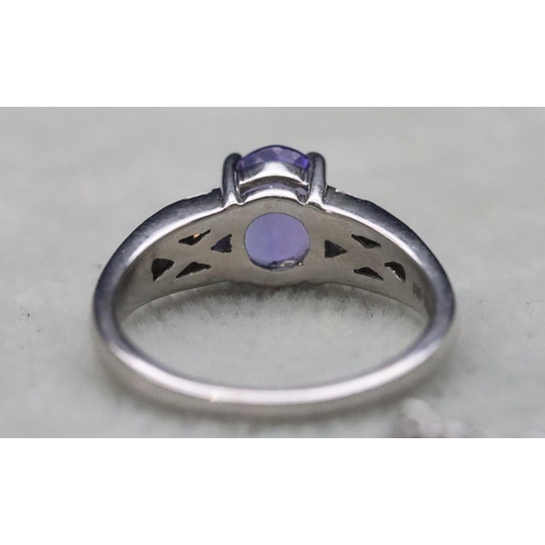 671 - A suite of 18ct white gold tanzanite and diamond jewellery, comprising of ring (Size L), drop pendan... 