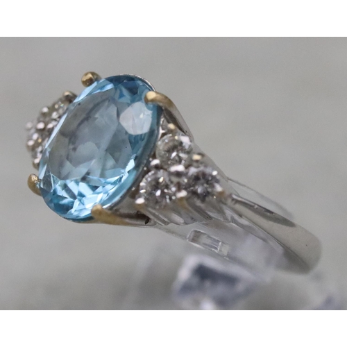 672 - An 18ct white gold ladies' ring set with large oval aquamarine, flanked by 6 diamonds, Size N/O, 10.... 