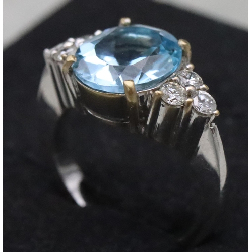 672 - An 18ct white gold ladies' ring set with large oval aquamarine, flanked by 6 diamonds, Size N/O, 10.... 