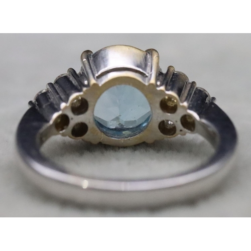 672 - An 18ct white gold ladies' ring set with large oval aquamarine, flanked by 6 diamonds, Size N/O, 10.... 