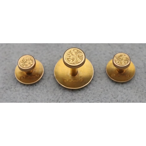 675 - A set of 3 15ct gold dress studs in fitted red leather case, 3.5 grams