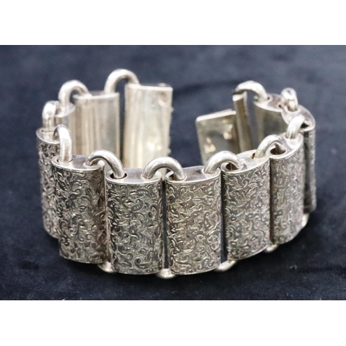 677 - A Victorian Continental silver coloured metal rectangular panel bracelet (1 link restored) with allo... 