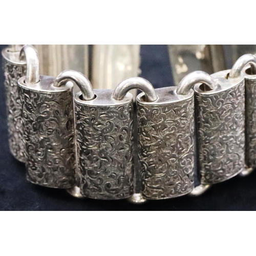 677 - A Victorian Continental silver coloured metal rectangular panel bracelet (1 link restored) with allo... 