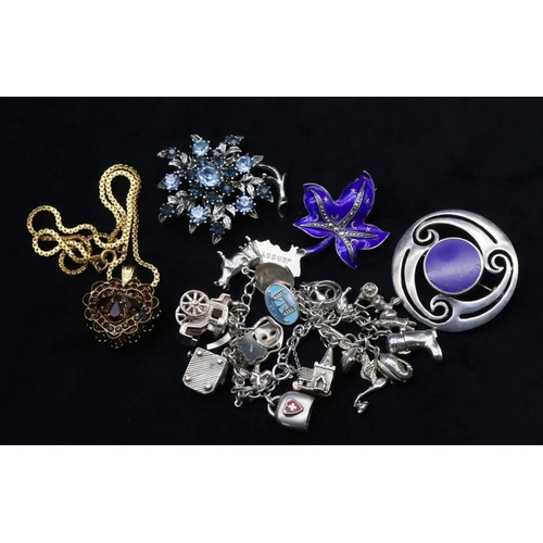 680 - A silver charm bracelet, 61.5 grams, 2 silver brooches, a further brooch and a gilt metal drop penda... 