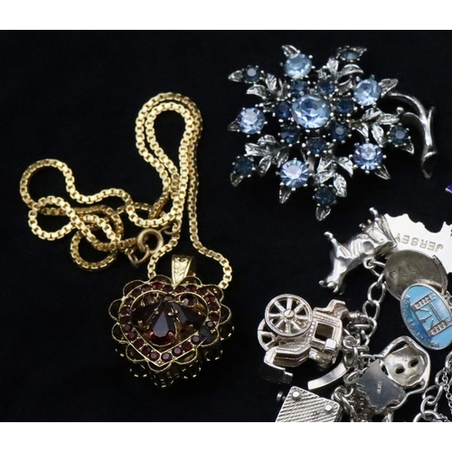 680 - A silver charm bracelet, 61.5 grams, 2 silver brooches, a further brooch and a gilt metal drop penda... 