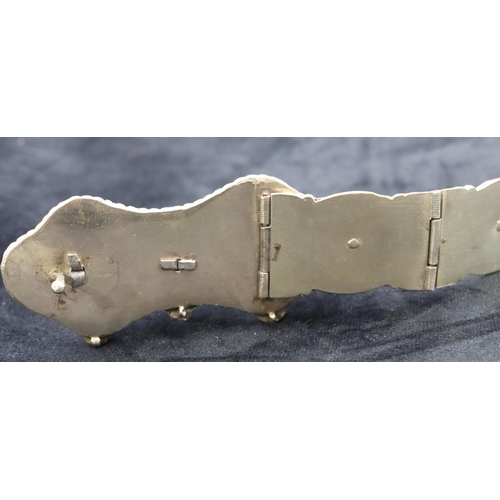 682 - An Eastern silver coloured panel bracelet with allover niello building decoration, 81cm long overall