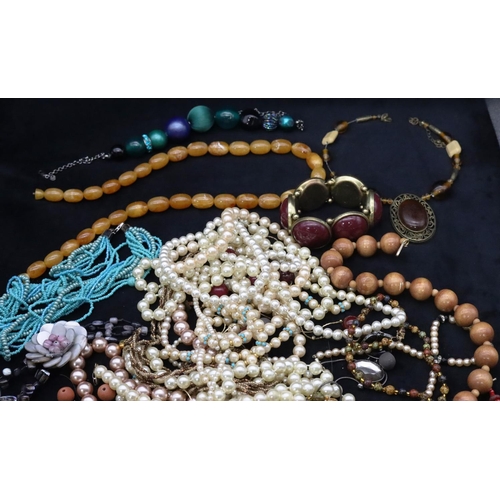 689 - A quantity of various costume bead necklaces, bracelets etc.