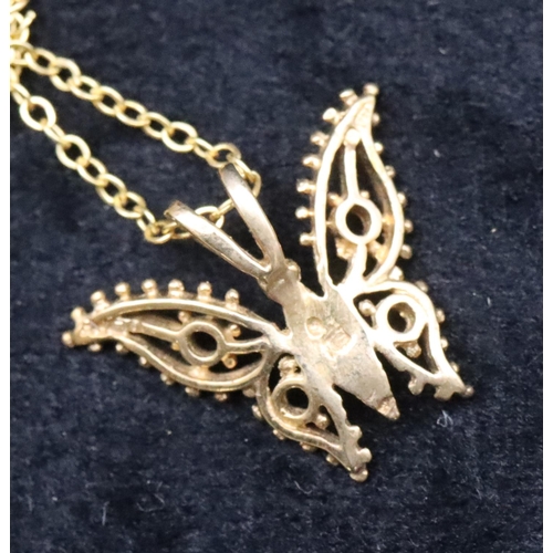 691 - A small 9ct gold pendant in the form of a butterfly with chain, 1.7 grams