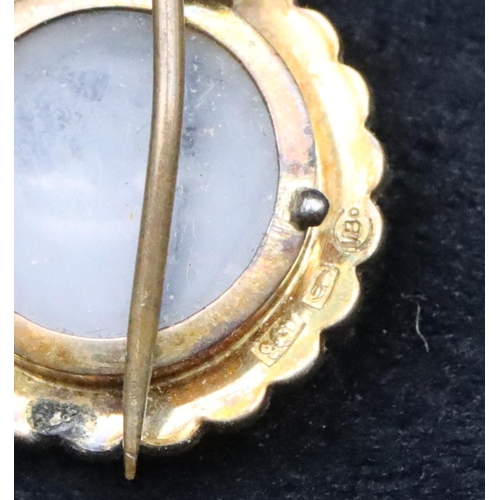 692 - A small 9ct gold circular locket brooch mounted with turquoise and half pearls (clasp a/f), 1.8cm di... 