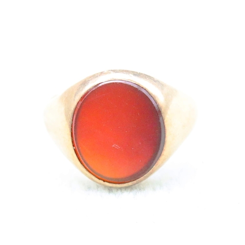 693 - A 9ct gentlemen's signet ring mounted with oval red stone, Size N/O, 4.4 grams gross