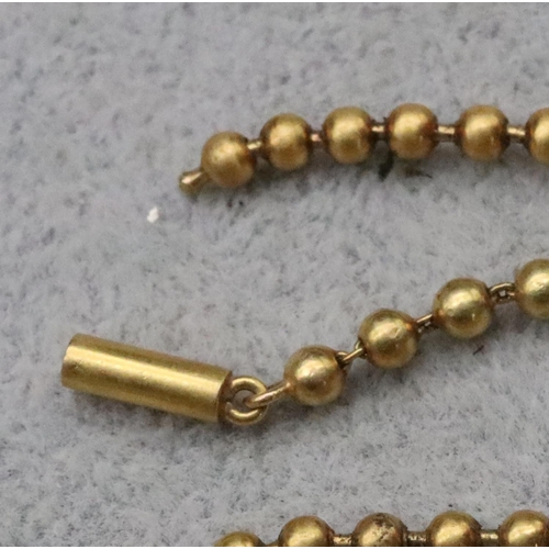 696 - A gold ball chain (clasp a/f), 38cm long, 9.1 grams