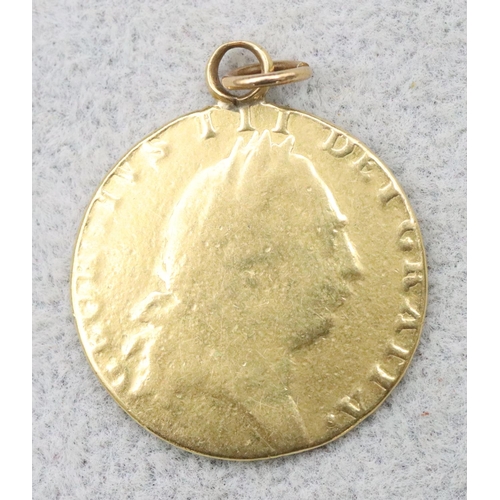 699 - An 18th Century George III gold Guinea, mounted as a pendant with soldered loop (worn), 1799?, 8.4 g... 