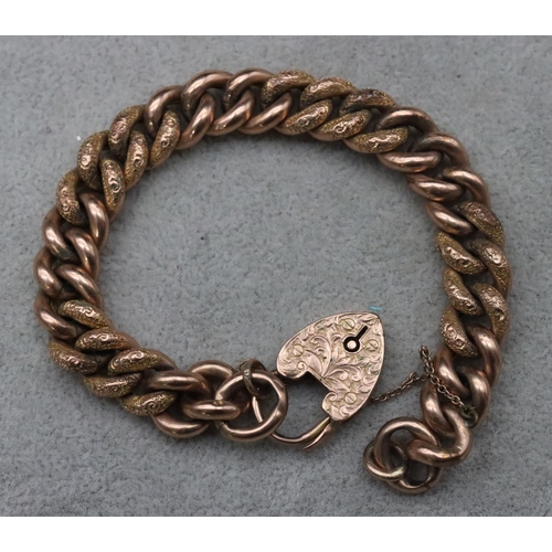 700 - A 9ct gold hollow linked bracelet with chased decoration and padlock clasp, 23.4 grams