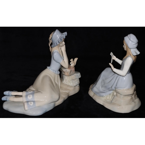 72 - 2 Lladro style figures of seated ladies, largest 23cm high (2)