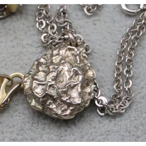 725 - A Birmingham silver nugget pendant with odd chain, a pair of ladies' clip-on earrings, a modern quar... 