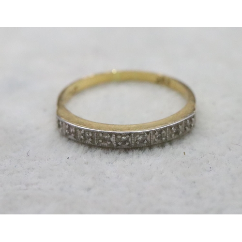 732 - An 18ct gold and platinum ladies' half eternity ring set with 9 diamonds, Size O/P, 2.5 grams gross