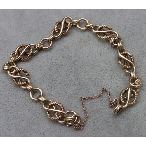 735 - A 9ct gold rectangular and circular linked bracelet, 22cm long, 20.6 grams