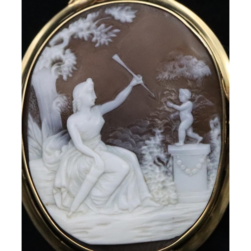 741 - A 19th Century cameo depicting a seated lady holding an arrow with cupid standing on plinth, in gold... 