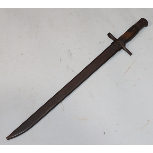 752 - A military bayonet with metal sheath, 52.5cm long overall