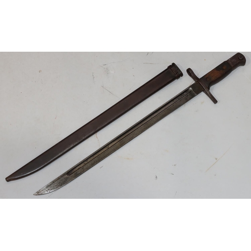 752 - A military bayonet with metal sheath, 52.5cm long overall