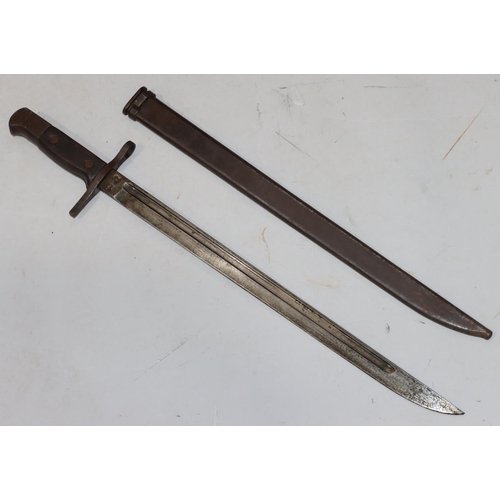 752 - A military bayonet with metal sheath, 52.5cm long overall