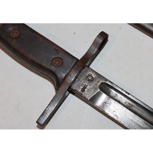 752 - A military bayonet with metal sheath, 52.5cm long overall