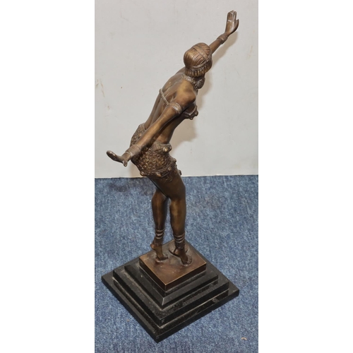 754 - A reproduction Art Deco bronze figure of a dancing lady on black square platform base, 41cm high