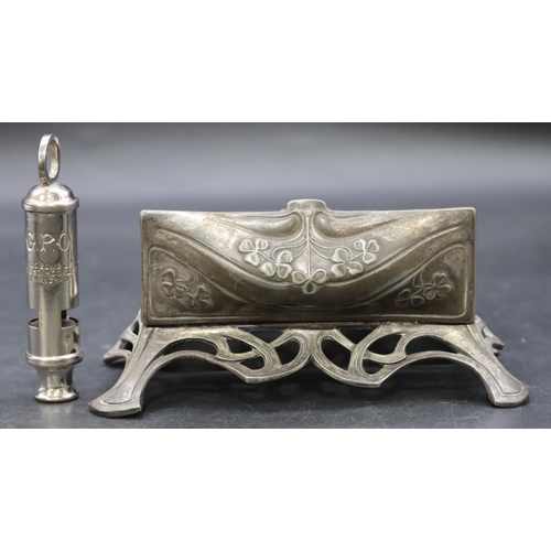 755 - An Art Deco pewter table top stamp box with hinged lid and embossed floral and leaf decoration, comp... 