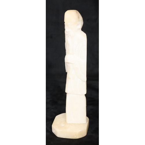 757 - An alabaster hardstone figure of a standing Oriental gentleman on square base, 34cm high