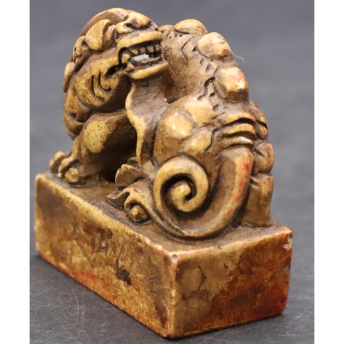 779 - A hardstone Oriental desk seal with animal motif, 5cm high