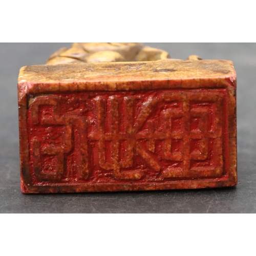 779 - A hardstone Oriental desk seal with animal motif, 5cm high