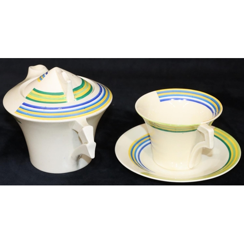 78 - A Clarice Cliff Bizarre teapot with matching cup and saucer on white ground with yellow, green and b... 