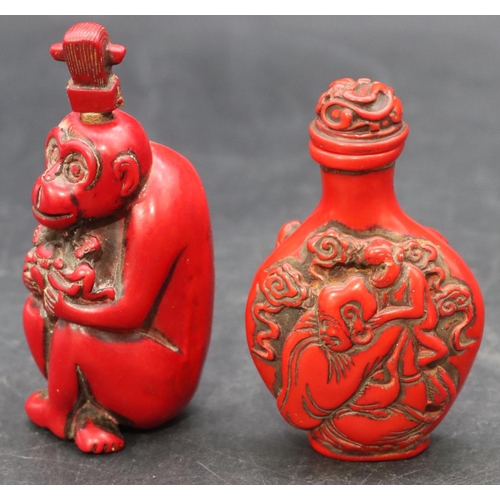 780 - A red lacquered scent bottle in the form of a seated monkey, 9cm high and another red lacquered scen... 