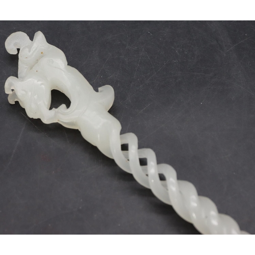 781 - A hardstone hairpin with animal motif, pierced and twist stem, 25cm long