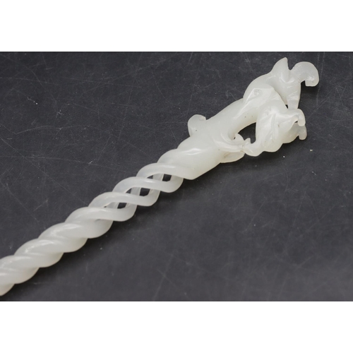 781 - A hardstone hairpin with animal motif, pierced and twist stem, 25cm long