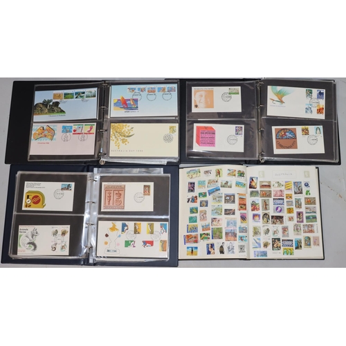 784 - A stamp album containing international stamps and 3 modern stamp albums containing Australian First ... 