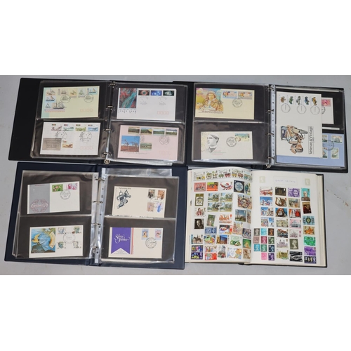 784 - A stamp album containing international stamps and 3 modern stamp albums containing Australian First ... 