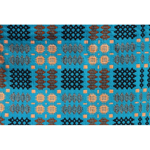 788 - An antique Welsh tapestry double-sided blanket on Prussian blue, golden amber and black ground, trad... 