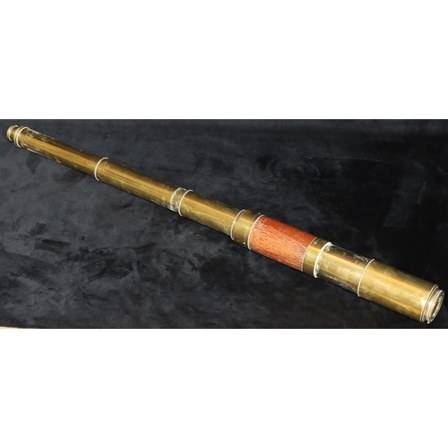 791 - A brass 4-sectioned telescope, 77cm long open, 30cm long closed