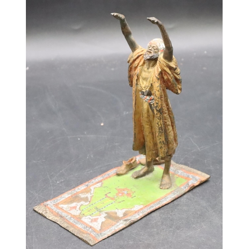 798 - A Venetian painted bronze figure of an Arabian man standing upon a carpet, 17cm high, 7.8cm wide, 14... 