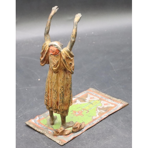 798 - A Venetian painted bronze figure of an Arabian man standing upon a carpet, 17cm high, 7.8cm wide, 14... 