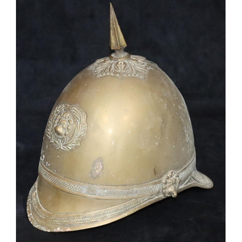 799 - A Prussian brass helmet with spike top (no leather straps or inner padding), 26cm high