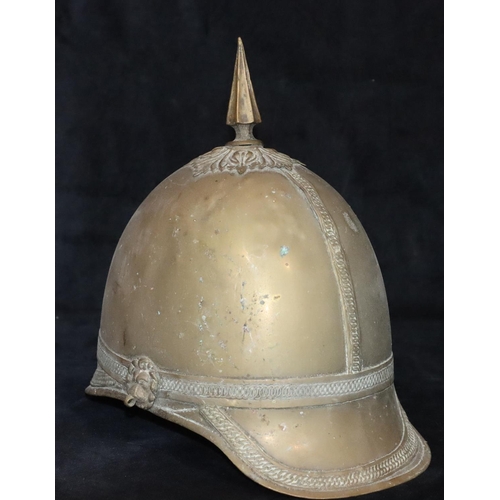 799 - A Prussian brass helmet with spike top (no leather straps or inner padding), 26cm high