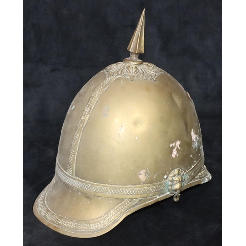 799 - A Prussian brass helmet with spike top (no leather straps or inner padding), 26cm high