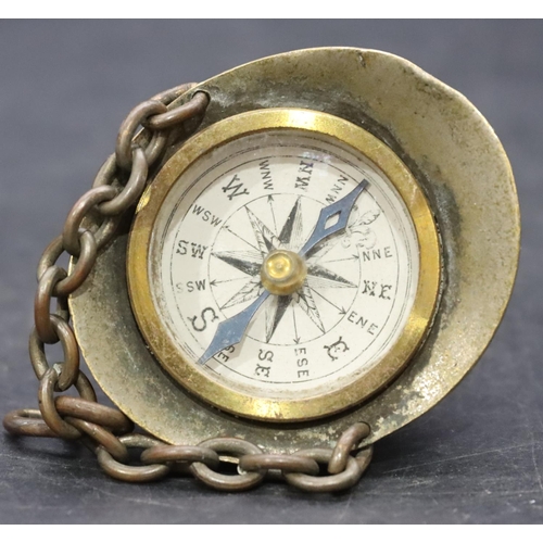 808 - A Novelty compass in the form of a pith helmet with chain, 4cm high